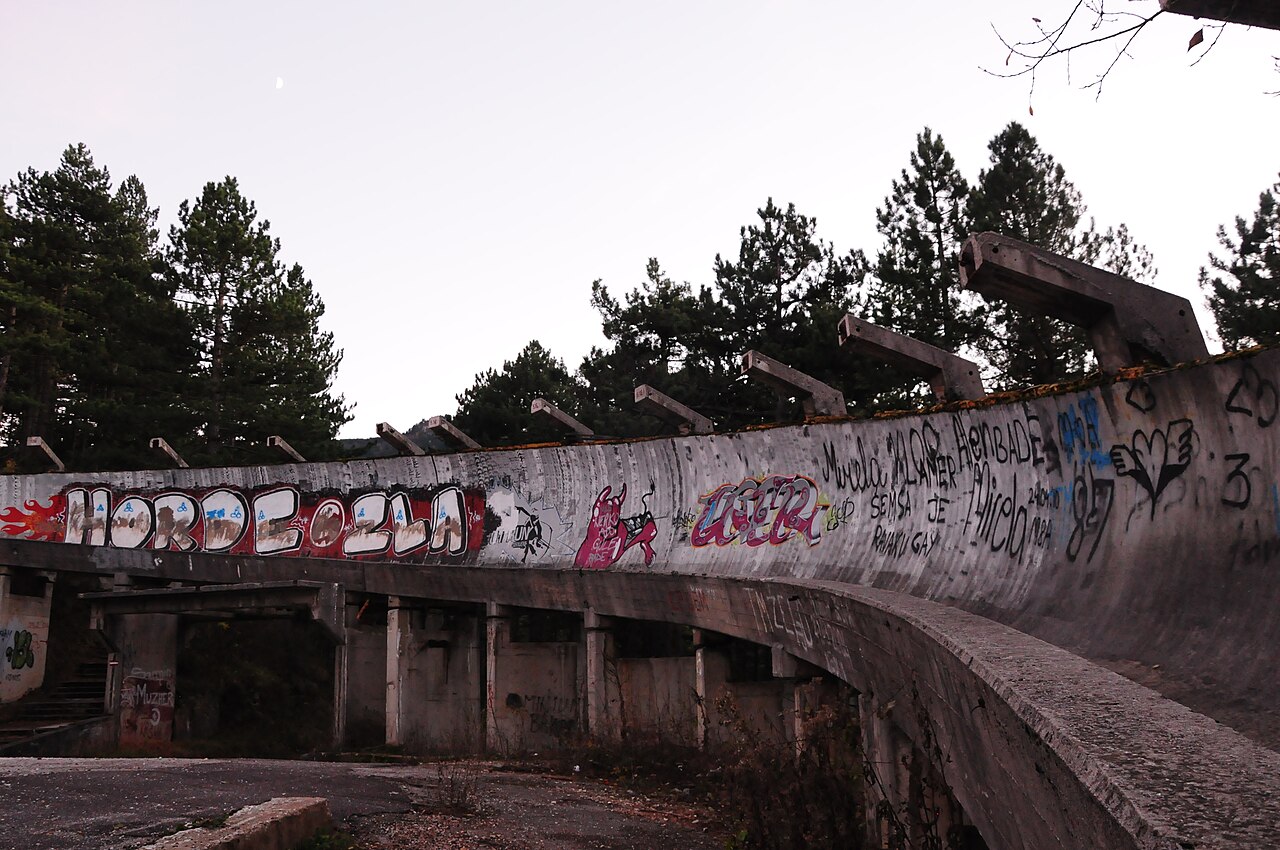 The abandoned 1984 Winter Olympics bobsled track on Mount Trebevic above Sarajevo, overgrown and covered in graffiti